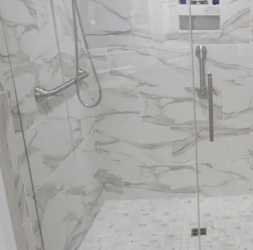 Grab bar installed on a marble shower wall in Hobe Sound, Florida