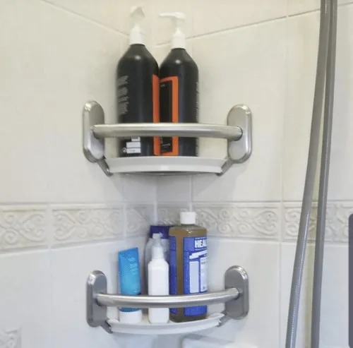Corner grab bar shelves holding shower products