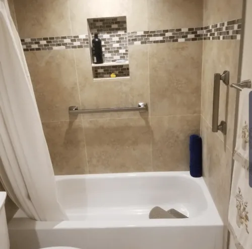 Horizontal and vertical grab bars over a bathtub